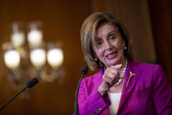 epa09357213 Speaker of the House Nancy Pelosi participates in a bill enrollment ceremony in the US Capitol in Washington, DC, USA, 21 July 2021. Speaker of the House Pelosi has rejected two top Republ ...