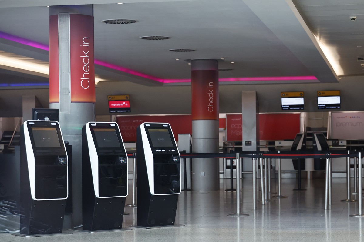 epa11978013 An empty check in hall at Heathrow Airport in London, Britain, 21 March 2025. Heathrow Airport on 21 March announced it would be closed all day, following a power outage 'due to a fir ...