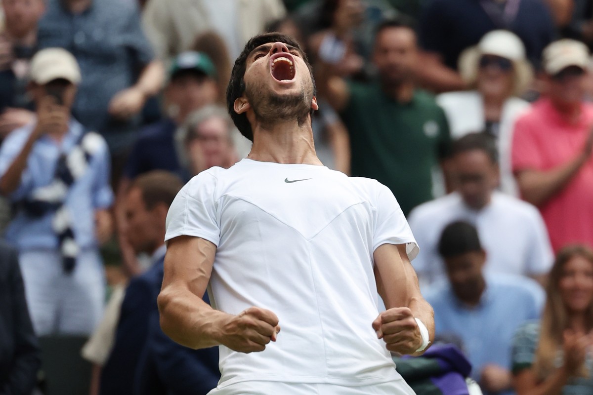 epa10742285 Carlos Alcaraz of Spain reacts after winning his Men's Singles quarter-finals match against Holger Rune of Denmark at the Wimbledon Championships, Wimbledon, Britain, 12 July 2023. EP ...