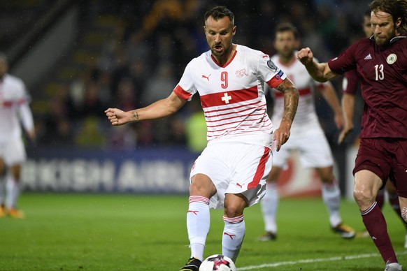 Swiss forward Haris Seferovic, scores the goal to the 0:1 during the 2018 Fifa World Cup group B qualifying soccer match Latvia against Switzerland at Skonto Stadium, in Riga, Latvia, Sunday, Septembe ...