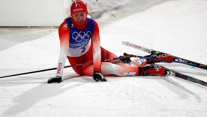 epa09738333 Nadine Faehndrich of Switzerland reacts after the Women&#039;s Individual Sprint final at the Zhangjiakou National Cross-Country Skiing Centre at the Beijing 2022 Olympic Games in Zhangjia ...