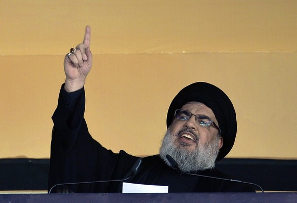 epa04992648 Hezbollah leader Hassan Nasrallah addresses the crowd during Ashura Day in southern Beirut, Lebanon, Beirut, Lebanon, October 24, 2015. Shia Muslims celebrate Ashura Day in the Islamic mo...