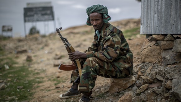 A fighter loyal to the Tigray People&#039;s Liberation Front (TPLF) mans a guard post on the outskirts of the town of Hawzen, then-controlled by the group but later re-taken by government forces, in t ...