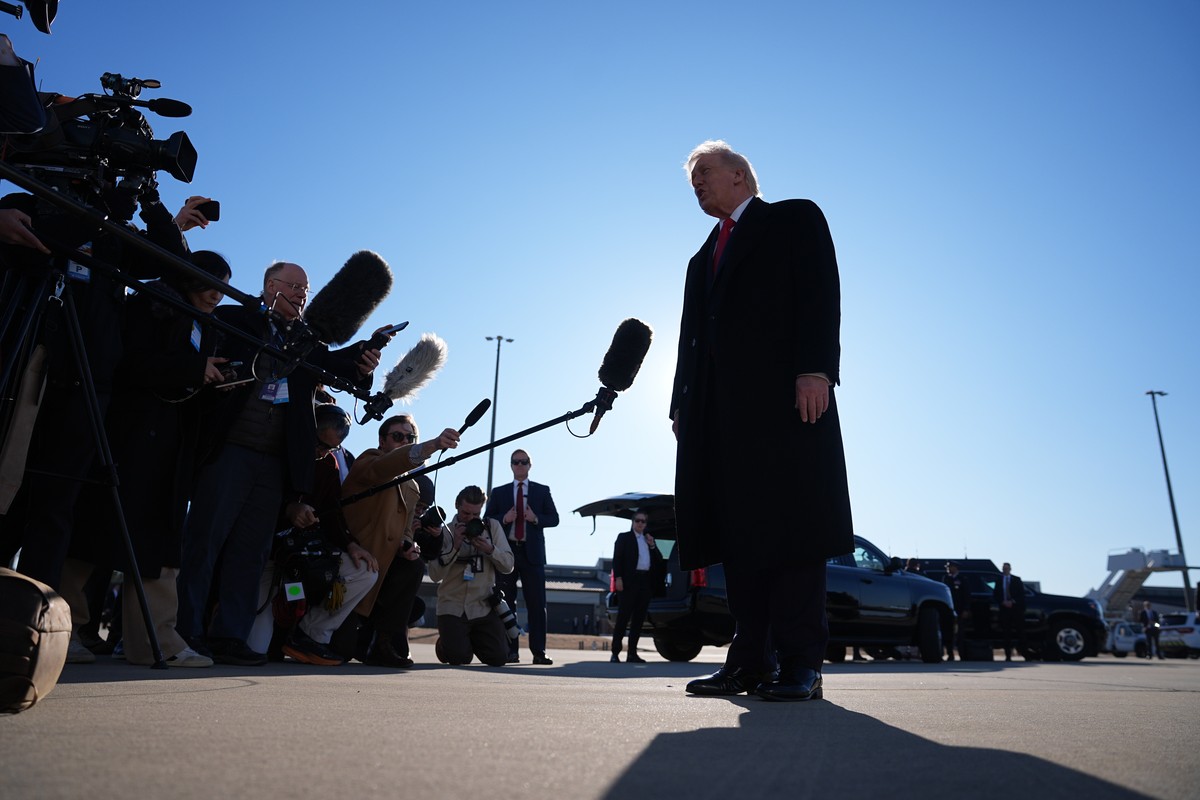 KEYPIX - President Donald Trump speaks to reporters before boarding Air Force One at Pope Army Airfield, in Fort Bragg, N.C., Friday, Feb. 13, 2026, en route to Palm Beach, Fla. (AP Photo/Matt Rourke)