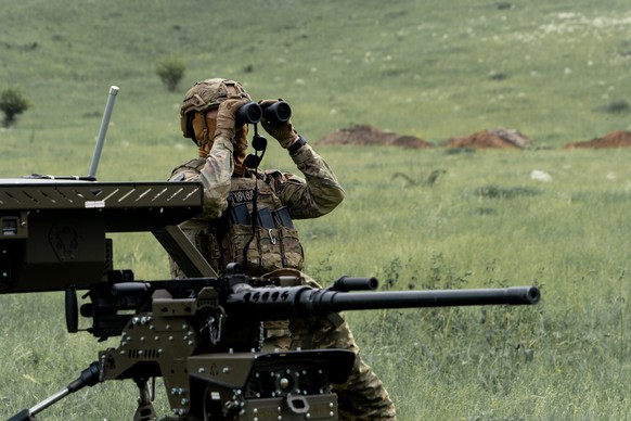 A Ukrainian serviceman of the Cerberus Ground Unmanned Systems Company of the 60th Separate Mechanized Brigade, Third Army Corps, conducts a drill with a combat ground drone during a training at the p ...