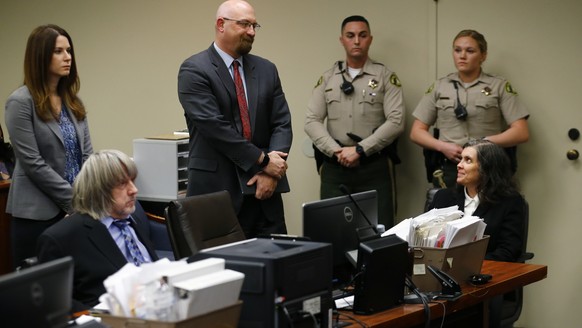 David, seated left, and Louise Turpin, seated right, appear in court with their attorneys in Riverside, Calif., Wednesday, Jan. 24, 2018. The couple are accused of abusing their 13 children - ranging  ...