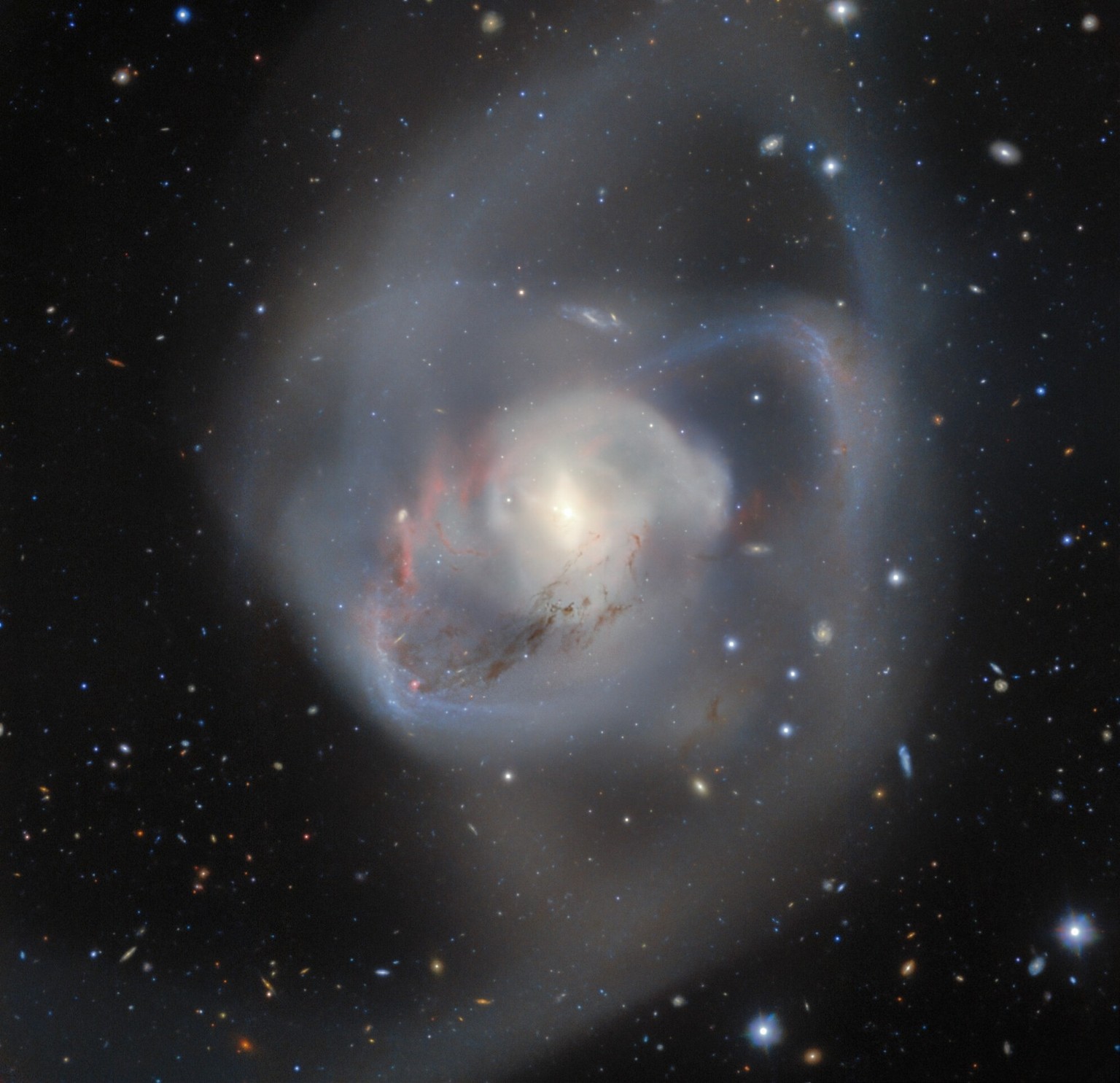 Gemini South, one half of the International Gemini Observatory operated by NSF’s NOIRLab, captures the billion-year-old aftermath of a double spiral galaxy collision. At the heart of this chaotic inte ...