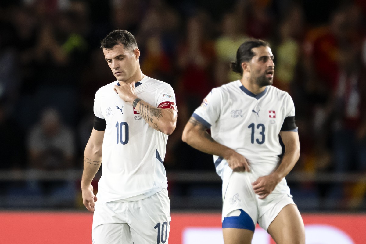 Switzerland's midfielder Granit Xhaka, left, reacts next to defender Ricardo Rodr?guez, right, during the UEFA Nations League soccer group A4 match between Spain and Switzerland at Heliodoro Rodr ...