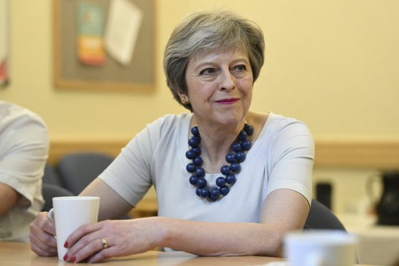 epa06658997 Britain&#039;s Prime Minister Theresa May meets staff at Addenbrooke&#039;s Hospital in Cambridge, Britain, 10 April 2018. The Prime Minster announced new funding and research for prostate ...