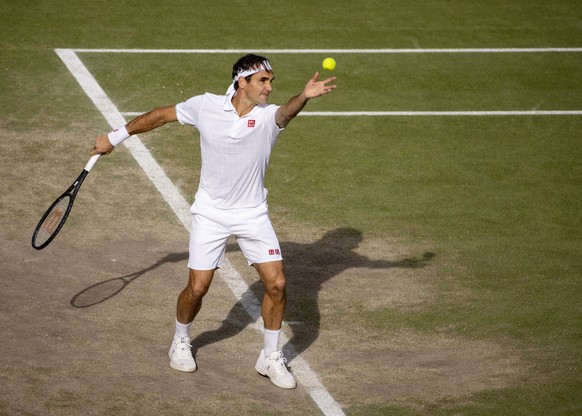 epa09329483 Roger Federer of Switzerland serves against Hubert Hurkacz of Poland in the quarter-final of the Gentlemen&#039;s Singles on Centre Court at The Championships 2021 at The All England Lawn  ...