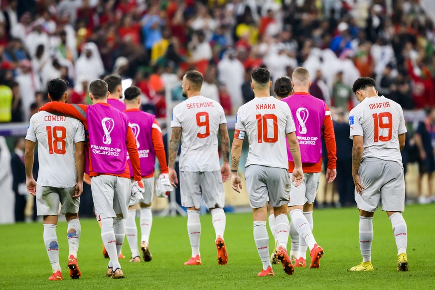 Switzerland's soccer players react after the elimination during the FIFA World Cup Qatar 2022 round of 16 soccer match between Portugal and Switzerland at the Lusail Stadium in Lusail, north of Doha,  ...