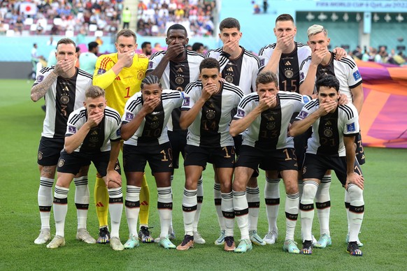 DOHA, QATAR - NOVEMBER 23: Germany players pose with their hands covering their mouths as they line up for the team photos prior to the FIFA World Cup Qatar 2022 Group E match between Germany and Japa ...