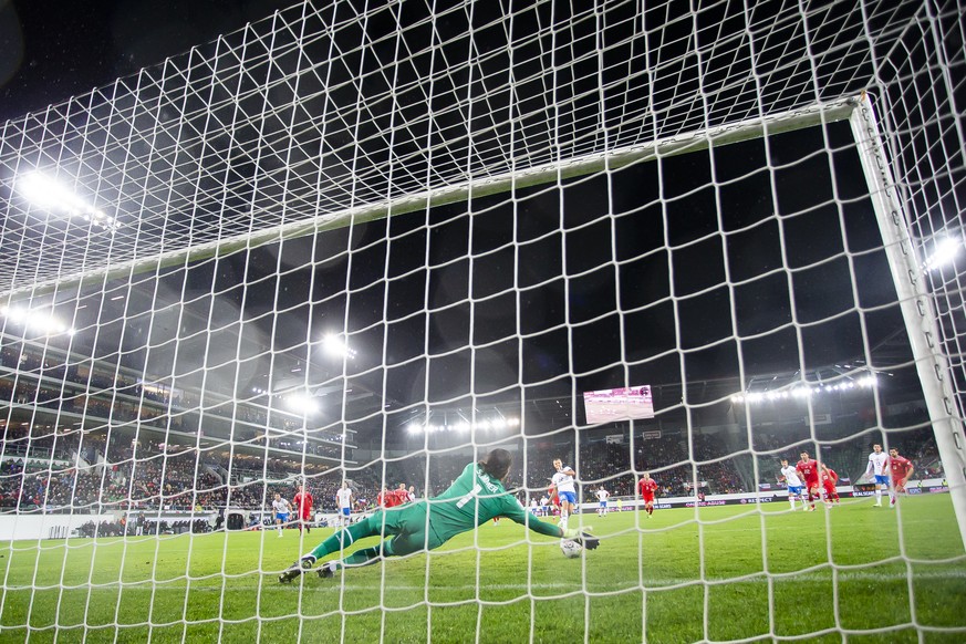 Switzerland's goalkeeper Yann Sommer, front, saves a penalty by Czech Republic's Tomas Soucek, center back, during the UEFA Nations League group A2 soccer match between Switzerland and Czech Republic, ...