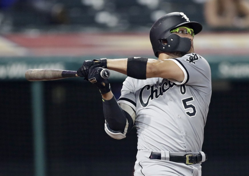 Chicago White Sox&#039;s Yolmer Sanchez hits an RBI-single off Cleveland Indians relief pitcher Evan Marshall in the eighth inning of a baseball game, Monday, June 18, 2018, in Cleveland. Adam Engel s ...