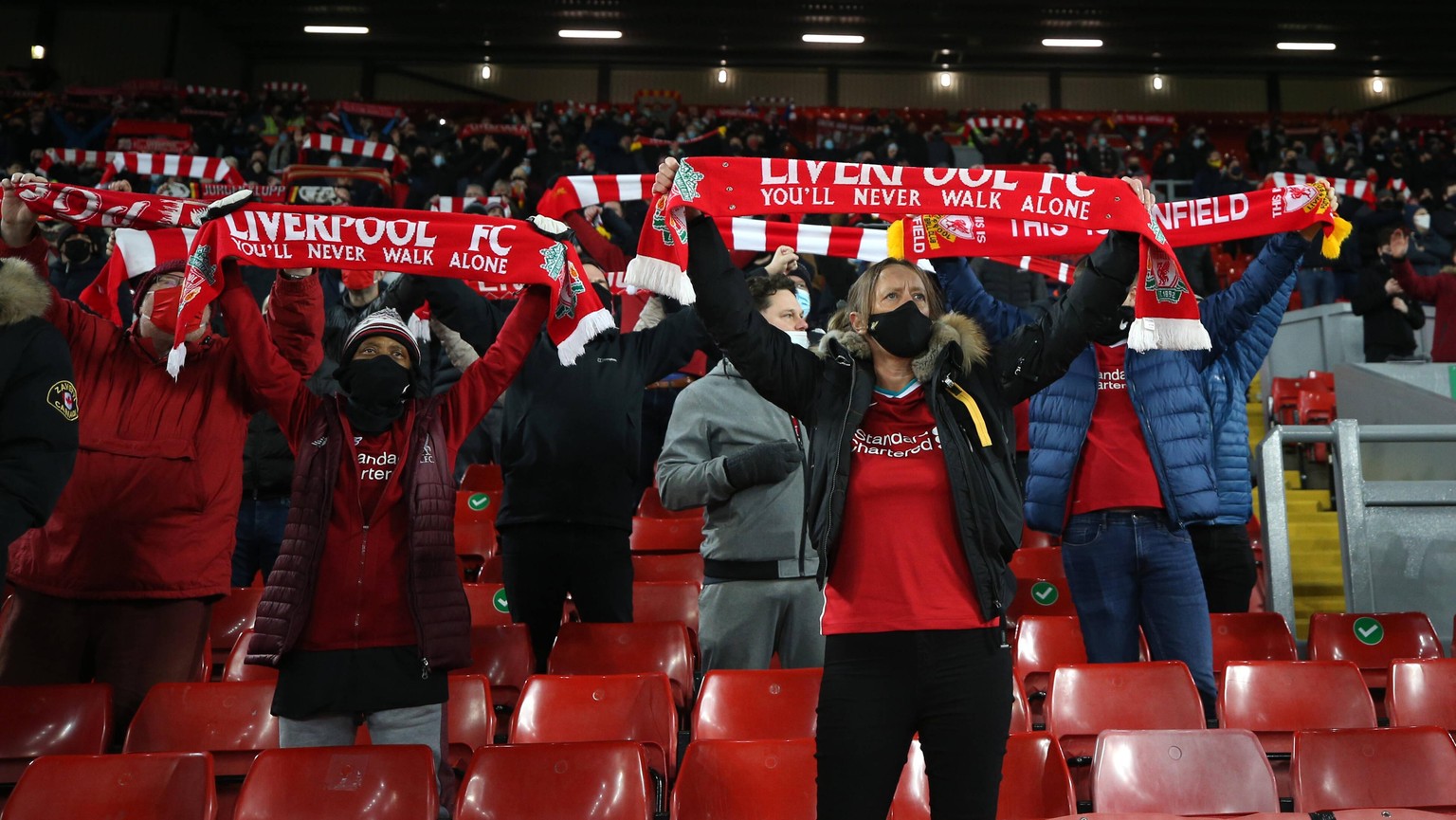 201207 -- LIVERPOOL, Dec. 7, 2020 -- Liverpool s supporters react before the English Premier League match between Liverpool FC and Wolverhampton Wanderers FC in Liverpool, Britain, on Dec. 6, 2020. FO ...