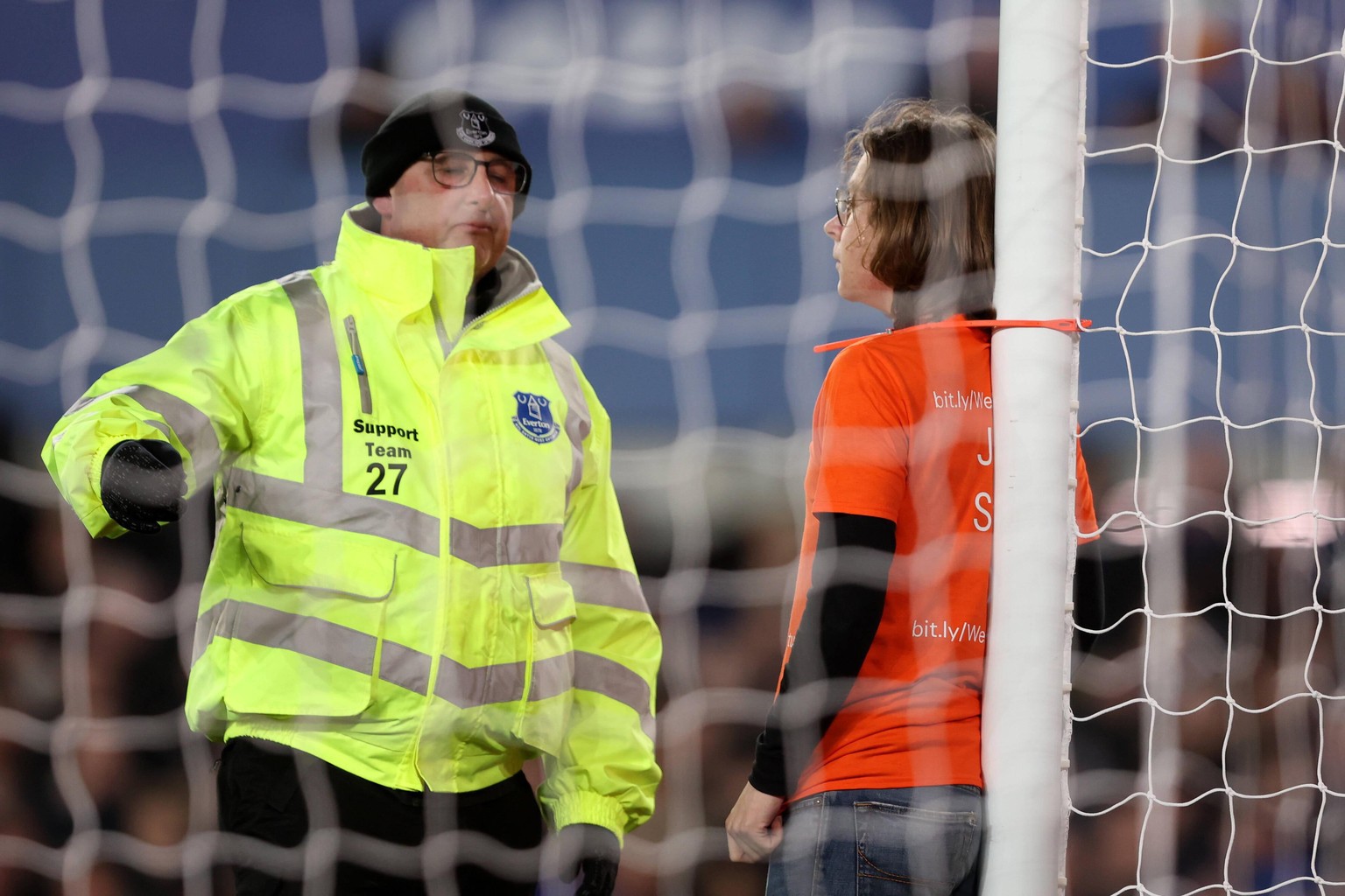 Liverpool, England, 17th March 2022. A protester attaches himself to the goal posts during the Premier League match at Goodison Park, Liverpool. Picture credit should read: Darren Staples / Sportimage ...