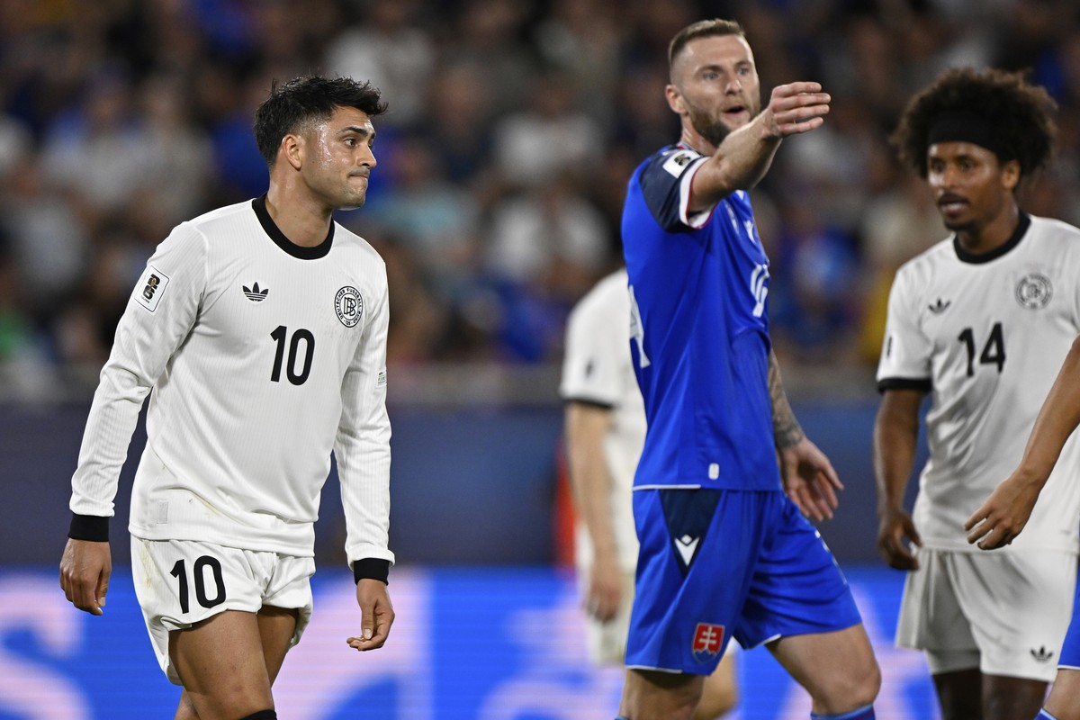Germany's Nadiem Amiri, left, and Karim Adeyemi react during the World Cup Group A qualifying soccer match between Slovakia and Germany in Bratislava, Slovakia, Thursday, Sept. 4, 2025. (AP Photo ...