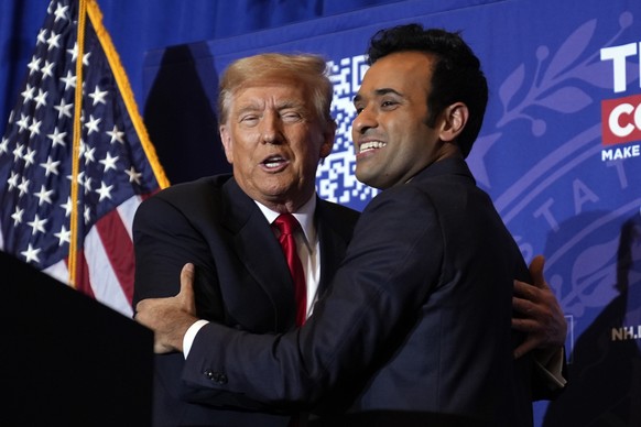 Republican presidential candidate former President Donald Trump embraces former candidate Vivek Ramaswamy at a campaign event in Atkinson, N.H., Tuesday, Jan. 16, 2024. (AP Photo/Matt Rourke)
Donald T ...
