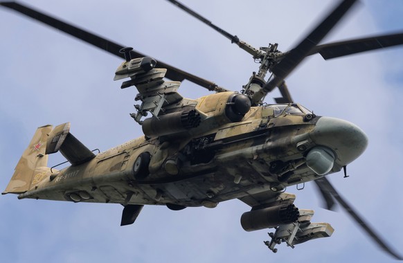 epa10163929 A handout photo made available by the press service of the Russian Defence Ministry on 06 September 2022 shows a Russian Kamov Ka-52 'Alligator' reconnaissance and attack helicopter taking ...