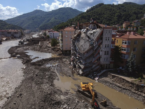 An aerial view of the city center in Bozkurt town of Kastamonu province, Turkey, Sunday, Aug. 15, 2021, damaged after flooding. Turkey sent ships to help evacuate people and vehicles from a northern t ...