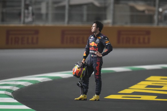 FILE - Red Bull driver Sergio Perez of Mexico waits for the safety car after race was stopped during the Formula One Saudi Arabian Grand Prix in Jiddah, Sunday, Dec. 5, 2021. (AP Photo/Hassan Ammar, F ...