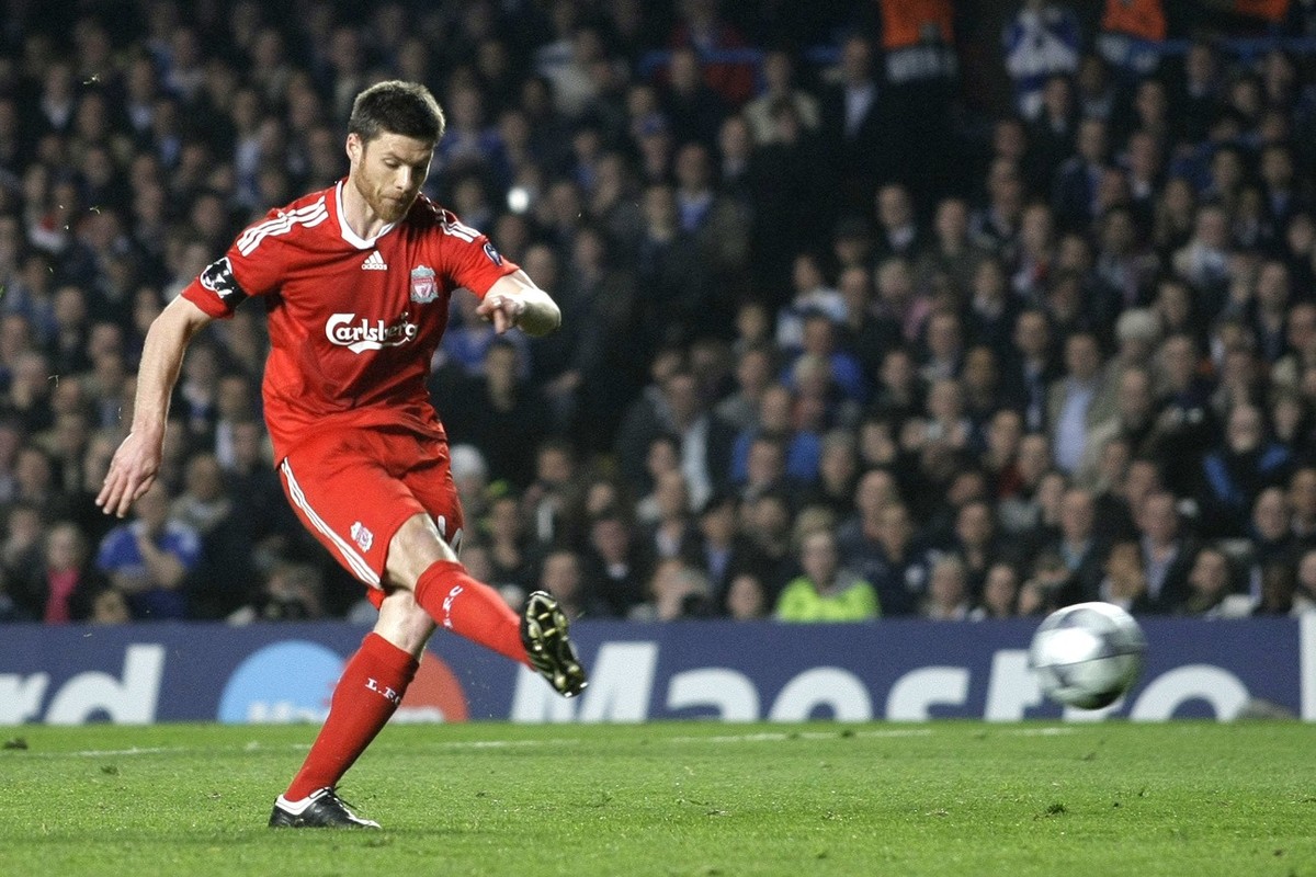 Liverpool's Xabi Alonso shoots from the penalty spot to score against Chelsea during their Champions League quarterfinal second leg soccer match at Stamford Bridge, in London, Tuesday, April 14,  ...