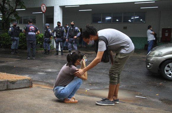 Raissa Floriano whose father is hospitalized with CCOVID-19, cries during a protest amid the new coronavirus pandemic outside the 28 Agosto Hospital, in Manaus, Brazil, Thursday, Jan 14, 2021. Scores  ...