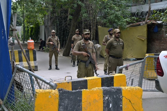 Police officers stand guard outside the residence of Pakistan&#039;s former Prime Minister Imran Khan, in Lahore, Pakistan, Saturday, Aug. 5, 2023. A Pakistani court convicted former Prime Minister Im ...