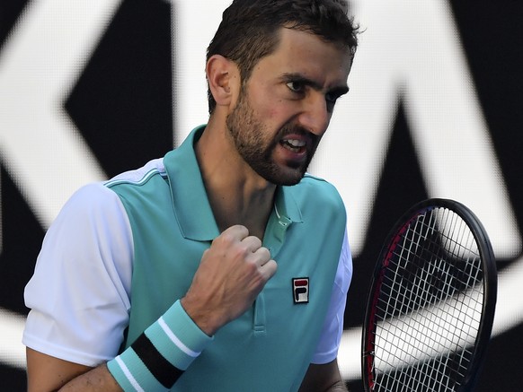 Croatia&#039;s Marin Cilic celebrates a point win over Canada&#039;s Vasek Pospisil during their first round match at the Australian Open tennis championships in Melbourne, Australia, Monday, Jan. 15, ...