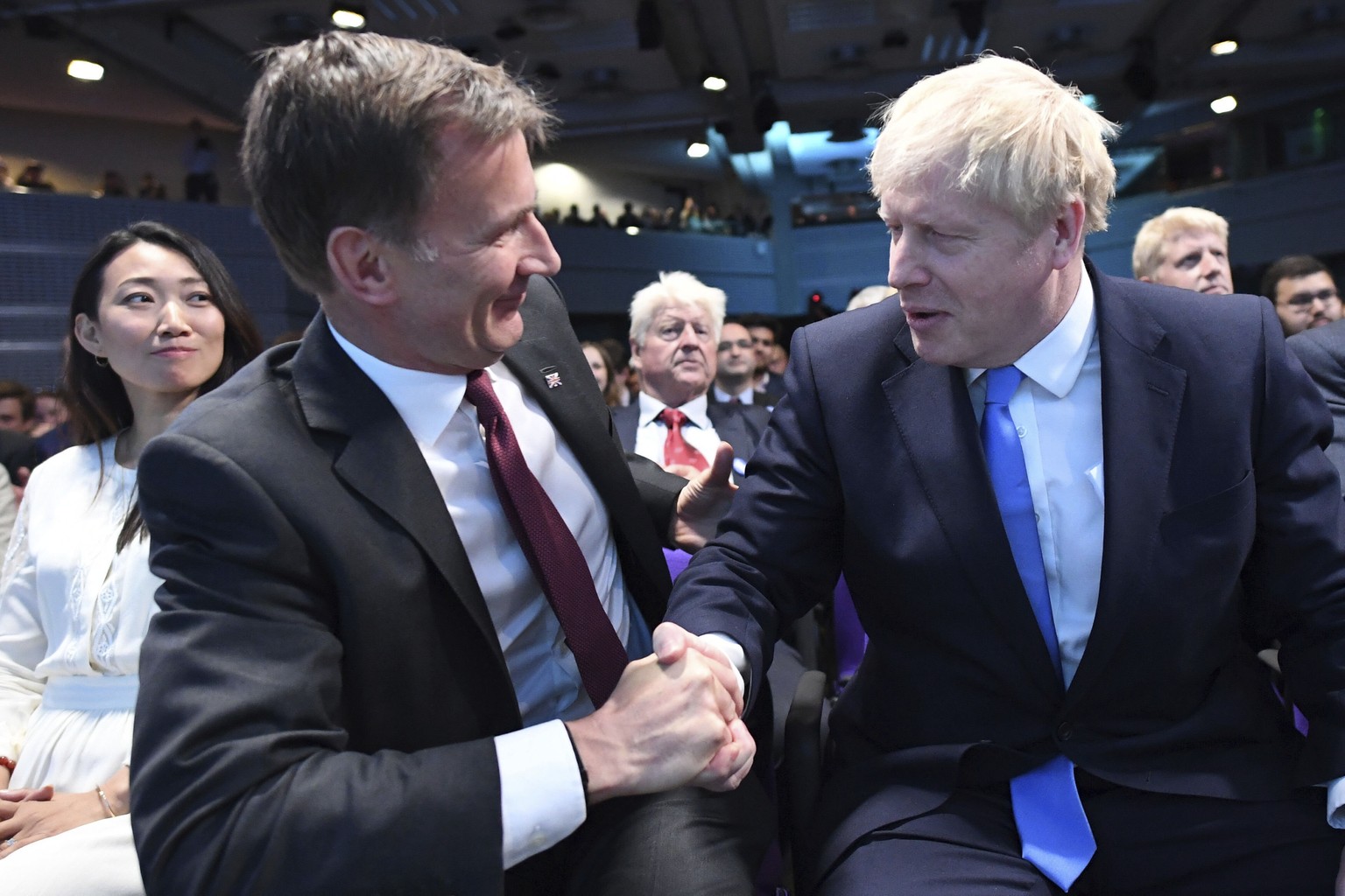 Jeremy Hunt, left, congratulates Boris Johnson after the announcement of the result in the ballot for the new Conservative party leader, in London, Tuesday, July 23, 2019. Brexit hardliner Boris Johns ...