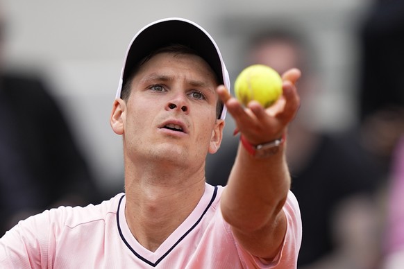 Poland&#039;s Hubert Hurkacz serves to Norway&#039;s Casper Ruud during their fourth round match of the French Open tennis tournament at the Roland Garros stadium Monday, May 30, 2022 in Paris. (AP Ph ...