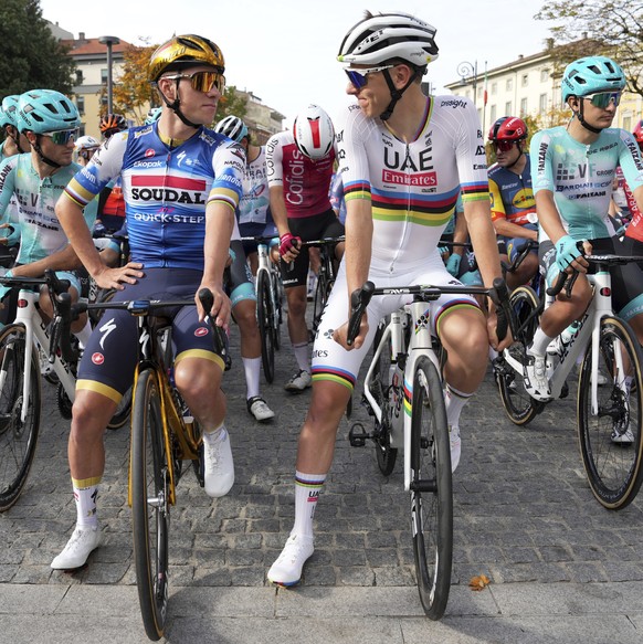 Belgium&#039;s Remco Evenepoel, left, and Slovenia&#039;s Tadej Pogacar prepare to start the Il Lombardia cycling race in Como, Italy, Saturday, Oct. 12, 2024. (Gian Mattia D&#039;Alberto/LaPresse via ...