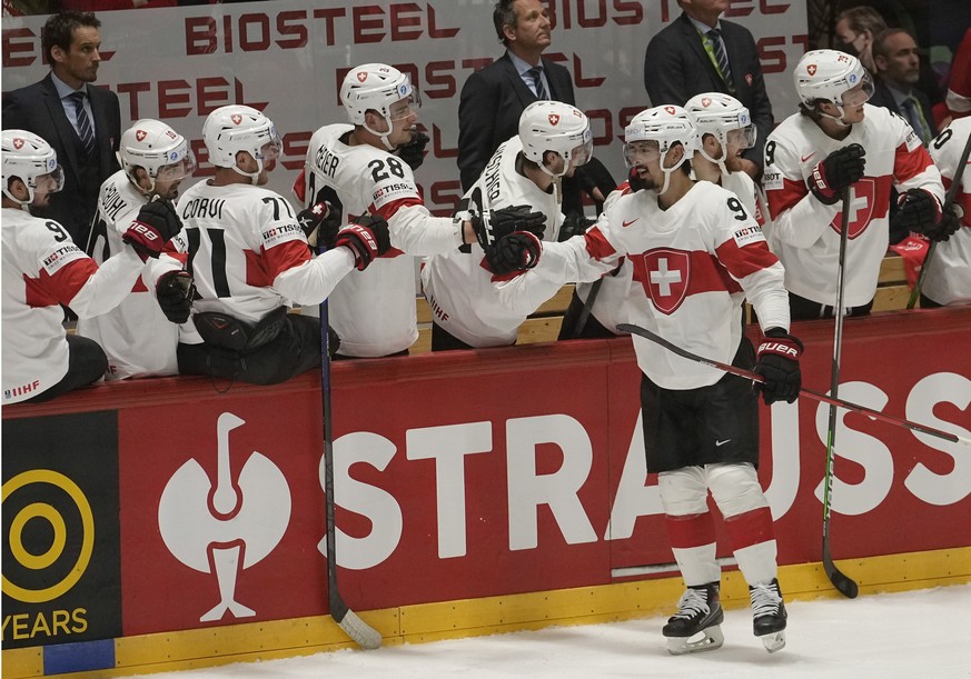 Jonas Siegenthaler from Switzerland, right, celebrates with the team after scoring his side&#039;s third goal during the group A Hockey World Championship match between Canada and Switzerland in Helsi ...