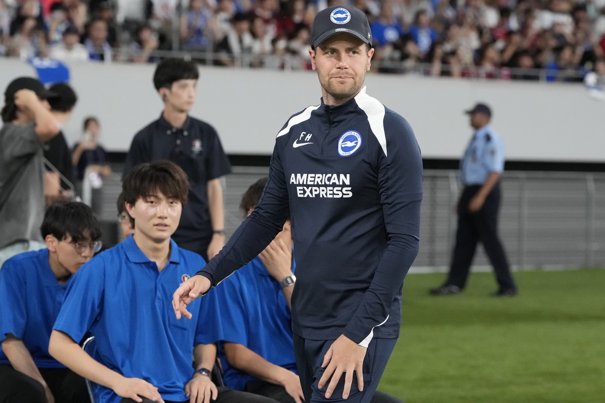 Brighton's coach Fabian Hurzeler walks on the pitch before a friendly soccer match against Kashima Antlers in Tokyo, Wednesday, July 24, 2024.(AP Photo/Shuji Kajiyama)