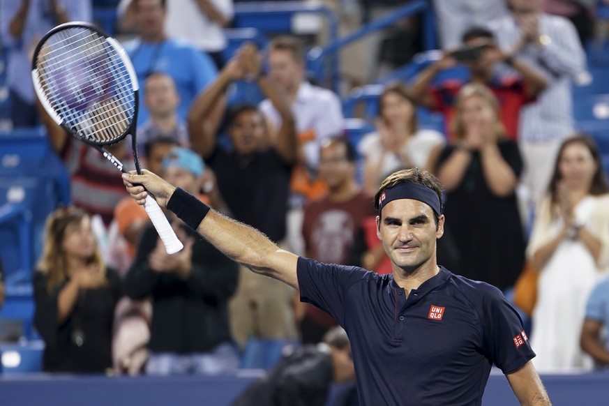 Roger Federer, of Switzerland, acknowledges the crowd after defeating Stan Wawrinka, of Switzerland, in a quarterfinal at the Western &amp; Southern Open tennis tournament Friday, Aug. 17, 2018, in Ma ...