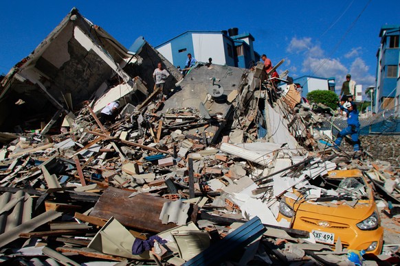 Residents search through the rubble after an earthquake struck Pereira, Colombia, Monday, Aug. 10, 2026. (AP Photo/Miguel Angel Lopez)
Colombia Earthquake