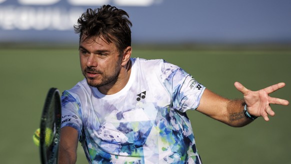 epa10832408 Stan Wawrinka of Switzerland returns the ball to Tomas Martin Etcheverry of Argentina during their second round match at the US Open Tennis Championships at the USTA National Tennis Center ...
