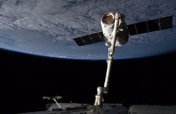 (FILES): This March 3, 2013 NASA image from video shows the SpaceX capsule Dragon attached to the Canada Arm at the International Space Staion (ISS). A SpaceX rocket exploded in midair during a test f ...