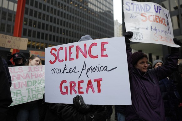 People hold signs as they stand up for Science rally to protest the Trump administration&#039;s science policies and federal job cuts Friday, March 7, 2025, in Chicago. (AP Photo/Nam Y. Huh)
Trump Sci ...