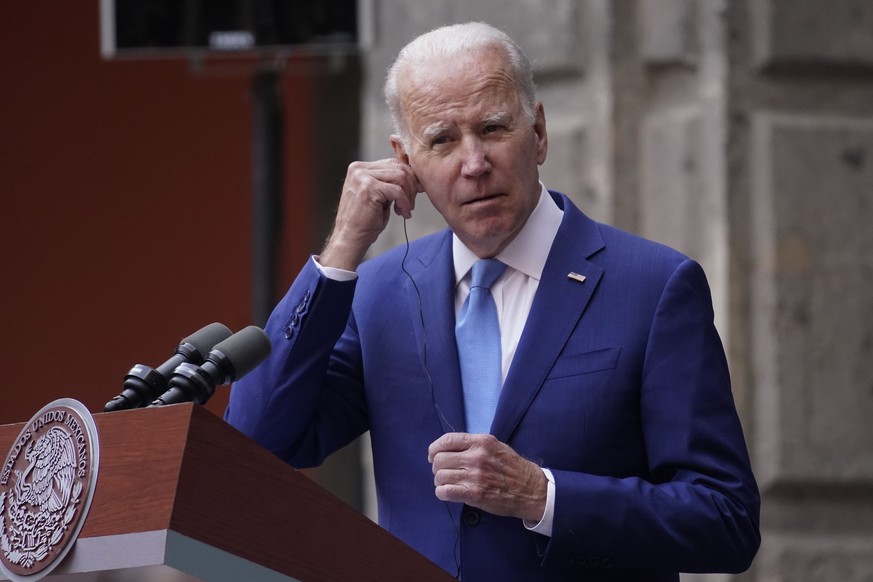 President Joe Biden listens during a news conference with Mexican President Andres Manuel Lopez Obrador and Canadian Prime Minister Justin Trudeau at the 10th North American Leaders&#039; Summit at th ...