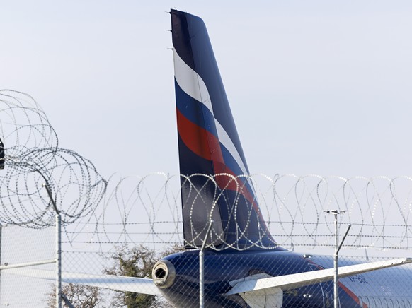 epa09807541 An Airbus A321-211 (VP-BOE) of the Russian Aeroflot airline is parked on the tarmac of the Geneve Aeroport due to the European Union and Canada Announcement that they were closing their ai ...