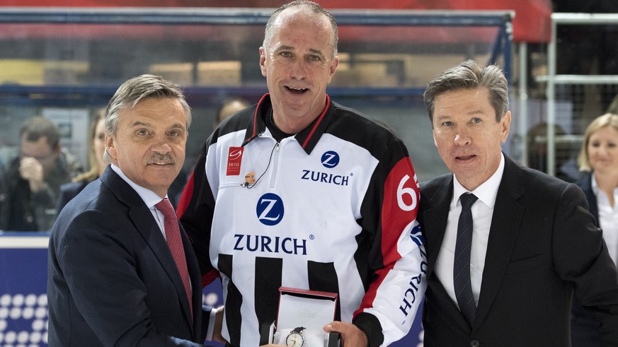 Rene Fasel, President of the International Ice Hockey Federation, IIHF, left, Danny Kurmann, referee, center, and Viatcheslav Arkadievitch &quot;Slava&quot; Bykov, former Russian ice hockey player, ta ...