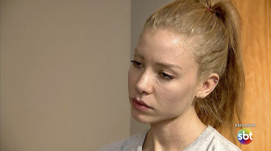 In this frame grab from video provided by the Brazilian TV network SBT, model Najila Trindade, 26, who has accused Brazilian soccer star Neymar of raping her in a Paris hotel, pauses during a televisi ...