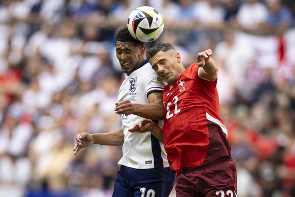 England&#039;s Jude Bellingham, left, and Switzerland&#039;s Fabian Schaer, right, in action during a quarter final match between England and Switzerland at the Euro 2024 soccer tournament in Duesseld ...