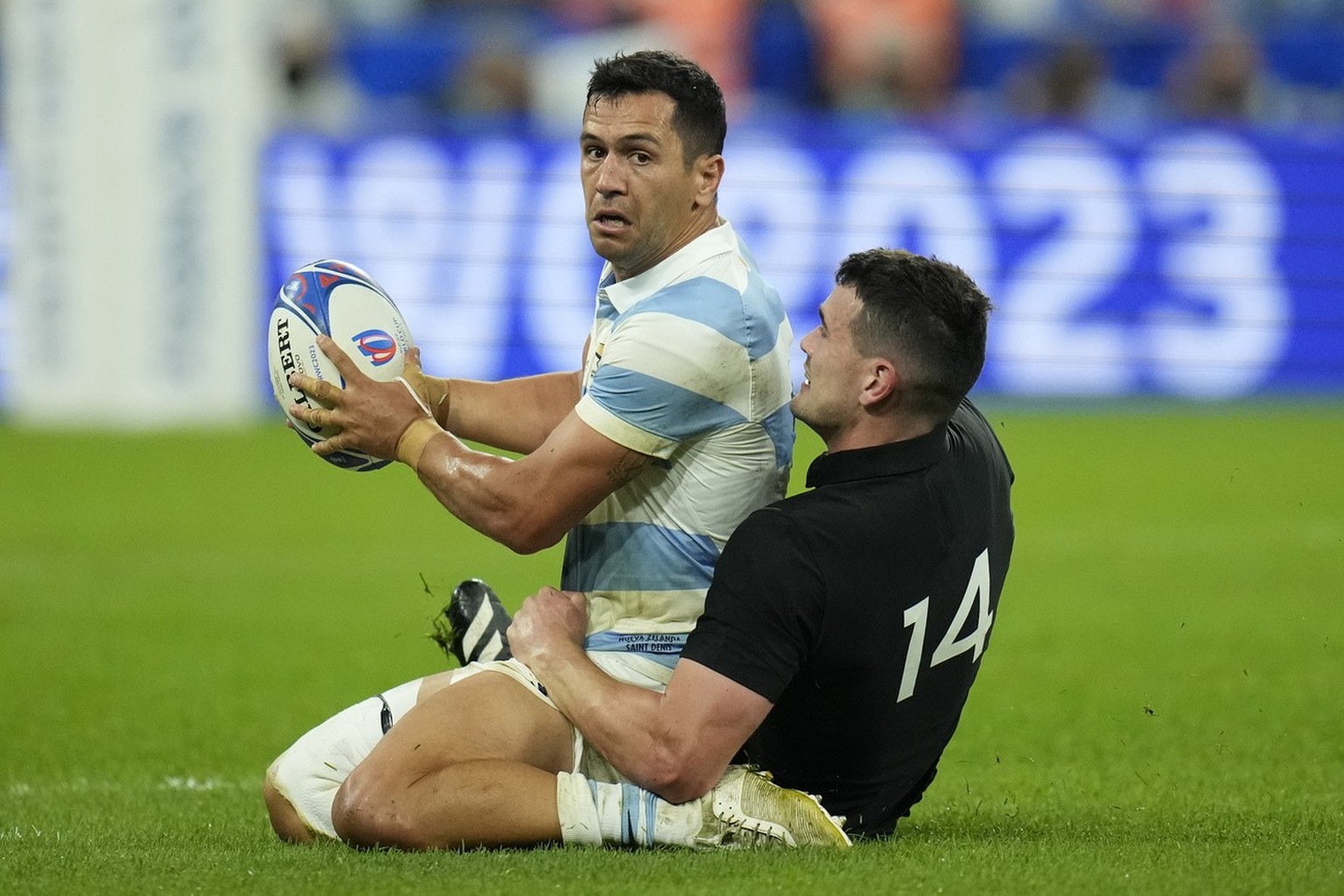 Argentina's Matias Moroni, left is brought down by New Zealand's Will Jordan during the Rugby World Cup semifinal match between Argentina and New Zealand at the Stade de France in Saint-Deni ...