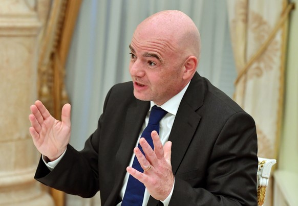 epa07382750 FIFA President Gianni Infantino gestures as he speaks during a meeting with Russian President Vladimir Putin (not pictured) at the Kremlin in Moscow, Russia, 21 February 2019. EPA/YURI KAD ...