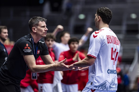 epa11826642 Switzerland&#039;s Head Coach Andy Schmid, left, talks to Switzerland&#039;s Mehdi Ben Romdhane, right, during the Preliminary Round Group A match between Czechia and Switzerland at the IH ...
