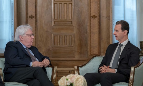 In this photo released on the official Facebook page of the Syrian Presidency, Syrian President Bashar Assad meets with Martin Griffiths, United Nations Under-Secretary-General for Humanitarian Affair ...