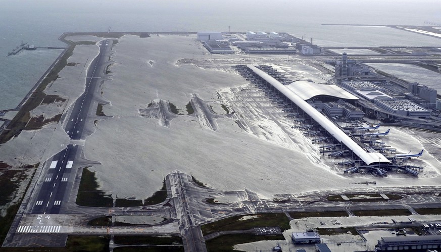 Kansai International Airport is partly inundated following a powerful typhoon in Izumisano, Osaka prefecture, western Japan, Tuesday, Sept. 4, 2018. A powerful typhoon blew through western Japan on Tu ...