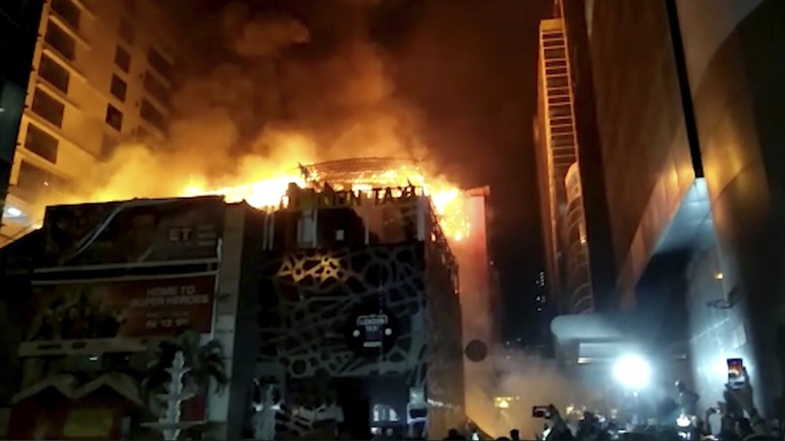 In this image made from video, a building is on fire in Mumbai, India, early Friday, Dec. 29, 2017. A number of people were killed and many more injured in a fire that broke out in a restaurant in Mum ...